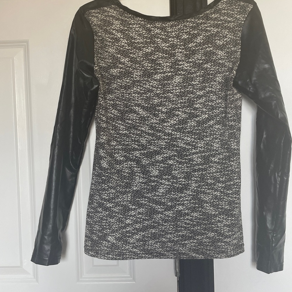 Leather sleeves and sweater material. Black